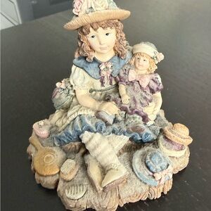 Charming Figurine with Blue and Purple Accents